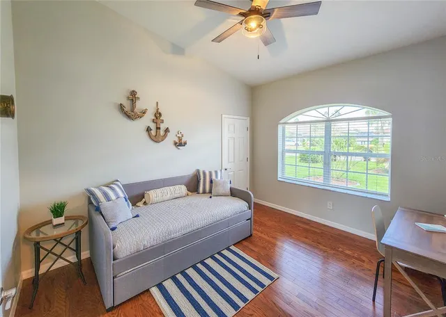 a bathroom with a double vanity sink a mirror and a toilet