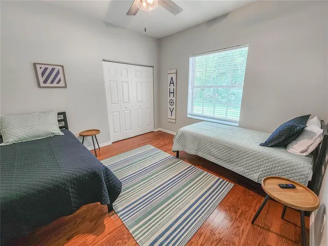 a bathroom with a double vanity sink mirror and shower
