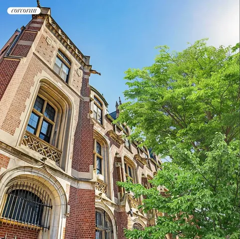 a view of a building with a tree