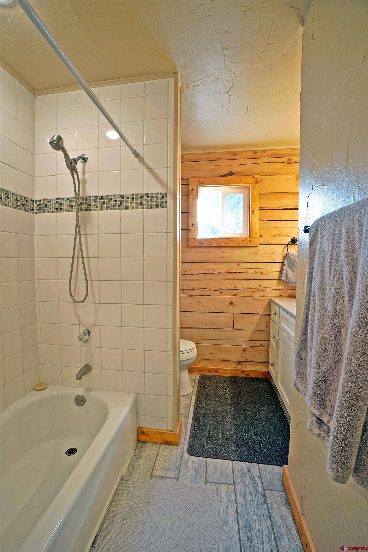 448 Whitehouse Vista Lane Ridgway, CO 81432 - Photo 25 of 34 a bathroom with a bathtub and a shower
