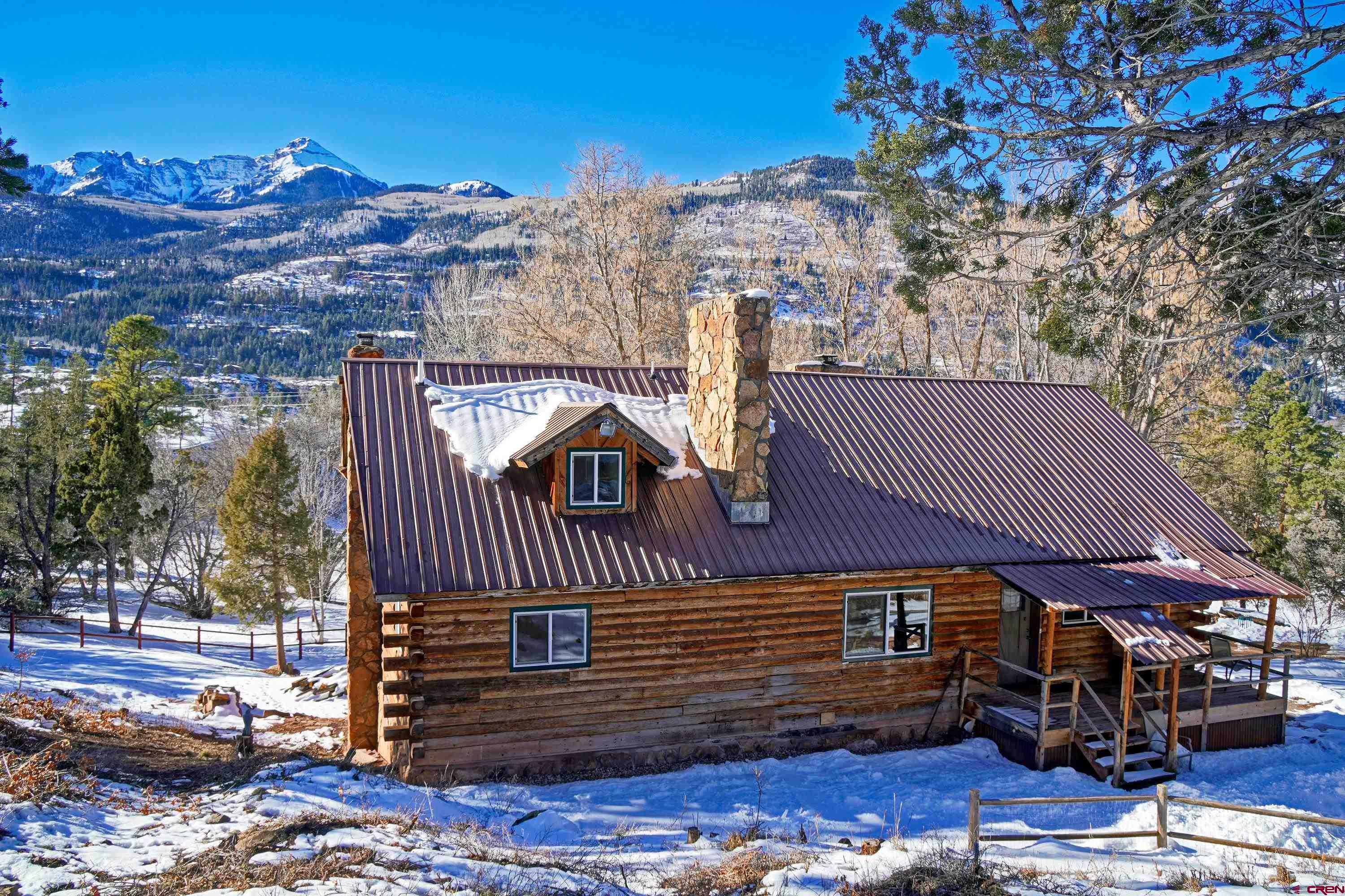 448 Whitehouse Vista Lane Ridgway, CO 81432 - Photo 3 of 34 a front view of a house with a yard