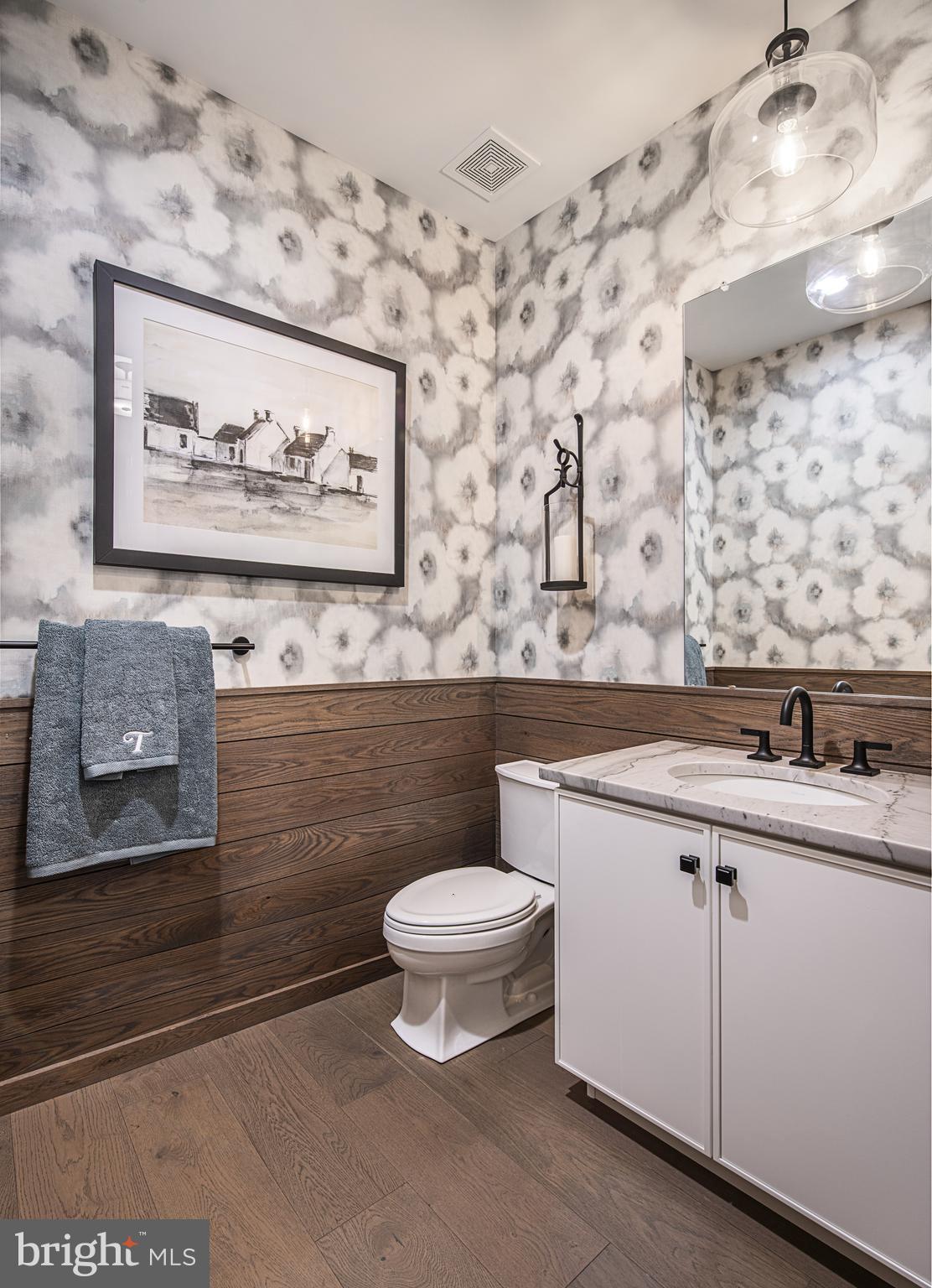 41 Alroy Road Malvern, PA 19355 - Photo 19 of 20 a bathroom with a toilet a sink and a mirror