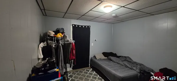 a view of walk in closet with clothes