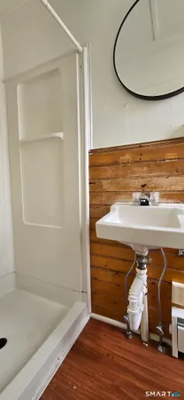 a bathroom with a tub and shower