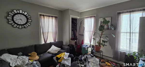 a living room with furniture and a window
