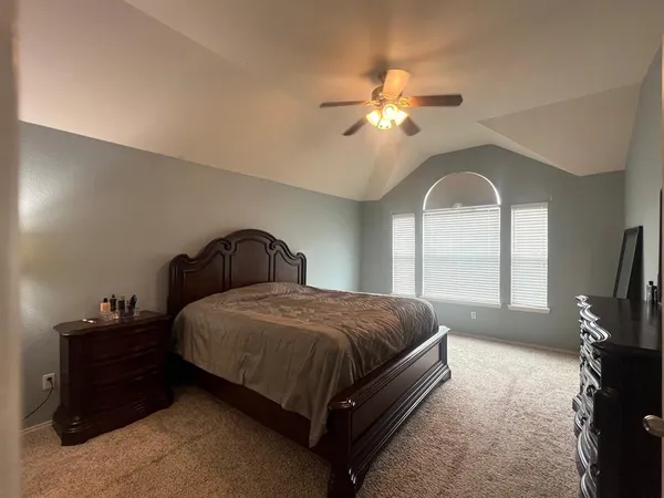 a spacious bathroom with a double vanity sink mirror and a bathtub