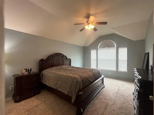 a spacious bathroom with a double vanity sink mirror and a bathtub