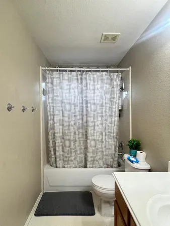 a view of a garden with furniture