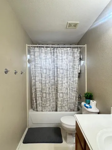 a view of a garden with furniture