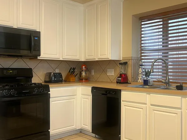 a living room with furniture window and wooden floor