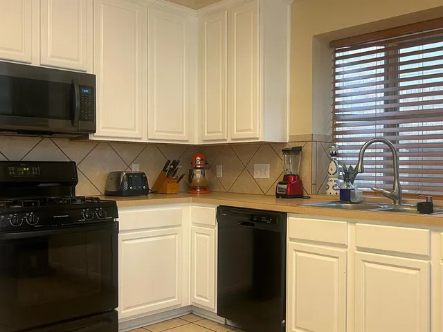a living room with furniture window and wooden floor