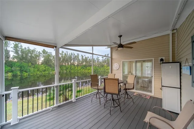 a view of a chairs and table in deck with wooden floor