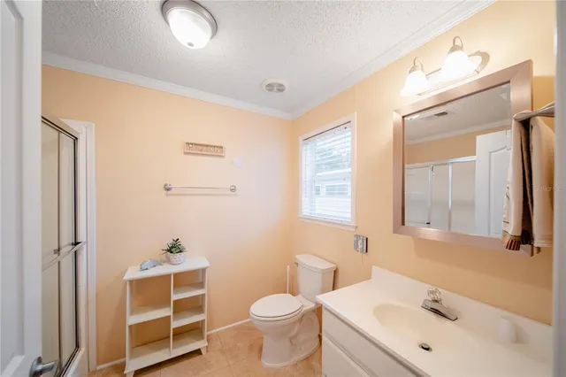 a bathroom with a sink toilet tub and shower