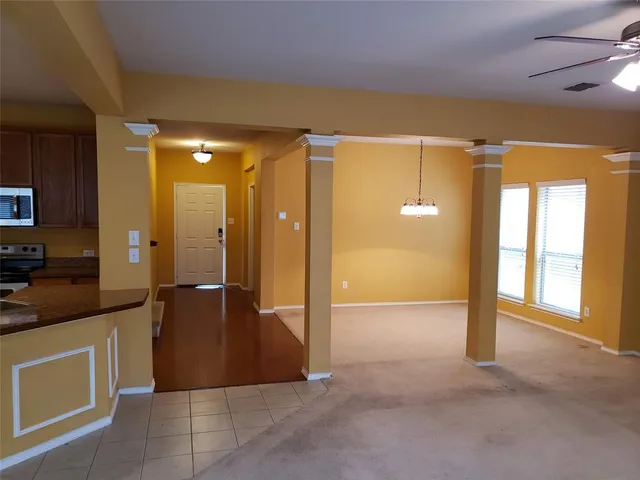 a view of a hallway with some storage and utility