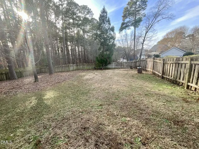 a backyard of a house with lots of green space