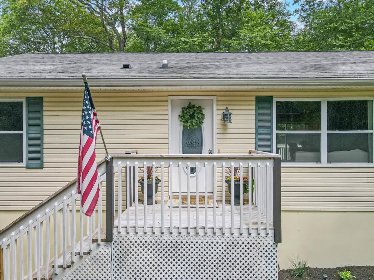 2236 Eagle Path Bushkill, PA 18324 - Photo 1 of 30 a view of a balcony with wooden floor and fence
