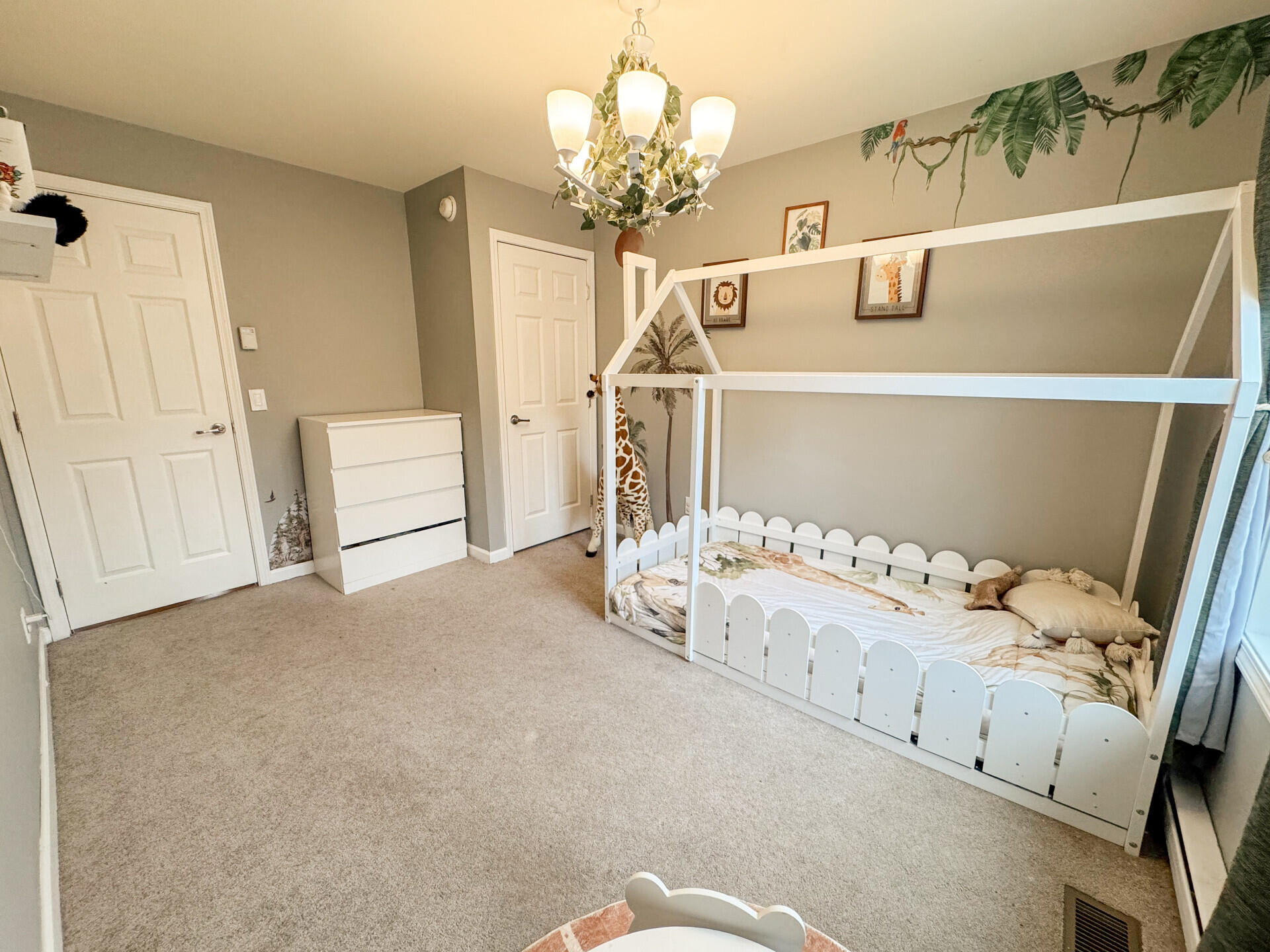 2236 Eagle Path Bushkill, PA 18324 - Photo 18 of 30 a bedroom with a bed and a chandelier