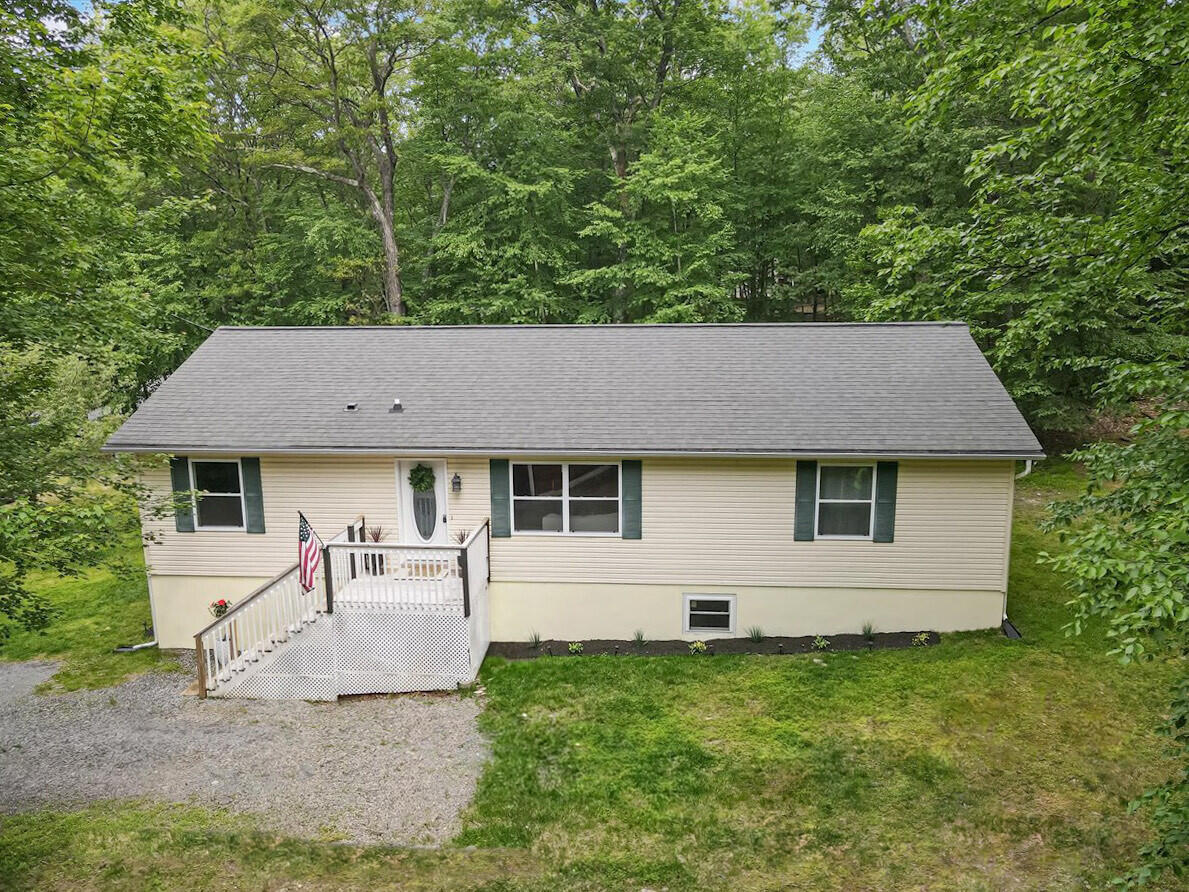 2236 Eagle Path Bushkill, PA 18324 - Photo 2 of 30 a backyard of a house with table and chairs