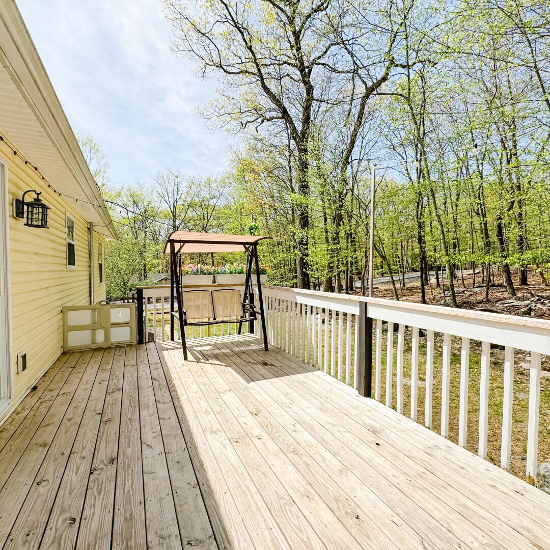 2236 Eagle Path Bushkill, PA 18324 - Photo 23 of 30 a view of balcony with wooden floor and fence
