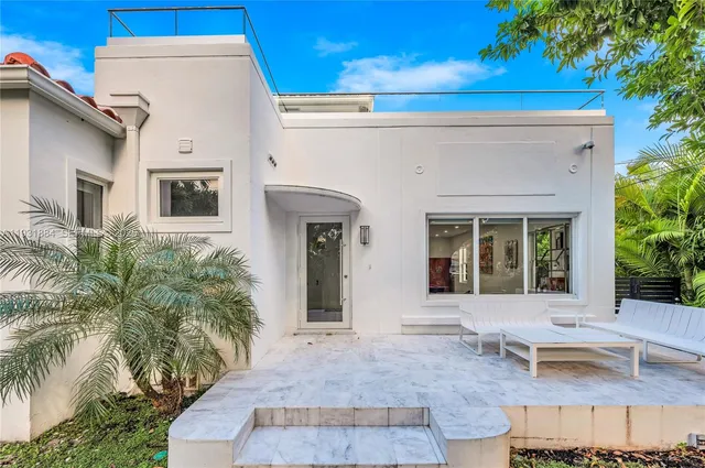 a living room with furniture pool table and a flat screen tv