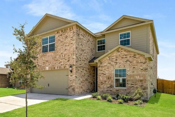 a view of front of house with a yard