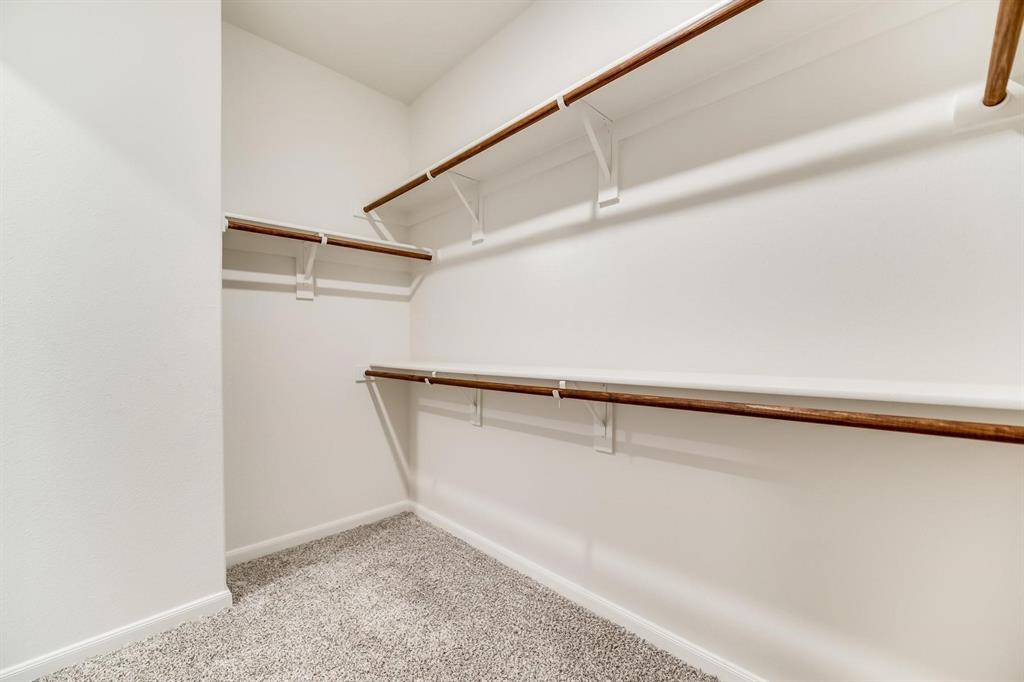 809 Calhoun Drive Anna, TX 75409 - Photo 7 of 12 a view of an empty walk in closet