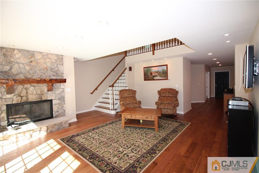 252 Deans Rhode Hall Road Monroe Township, NJ 08831 - Photo 11 of 25 a living room with furniture and a fireplace