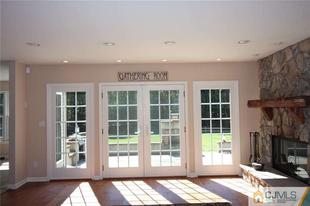 252 Deans Rhode Hall Road Monroe Township, NJ 08831 - Photo 12 of 25 a view of an empty room with wooden floor and a window
