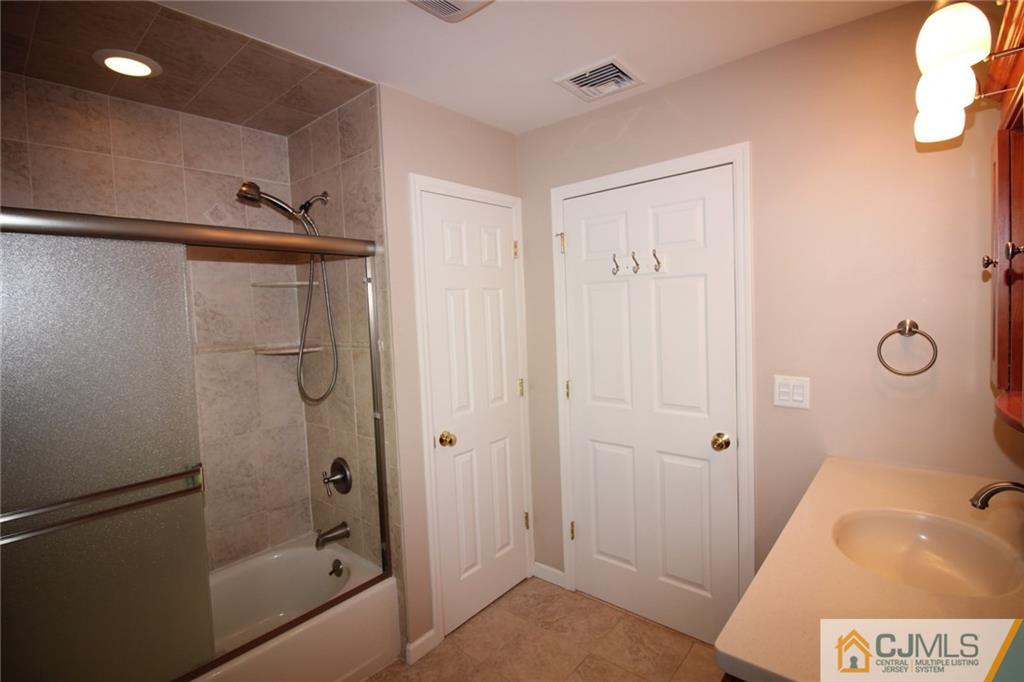 252 Deans Rhode Hall Road Monroe Township, NJ 08831 - Photo 14 of 25 a bathroom with a tub and shower