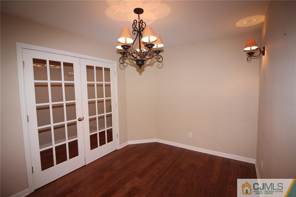 252 Deans Rhode Hall Road Monroe Township, NJ 08831 - Photo 15 of 25 a view of a house with wooden floor
