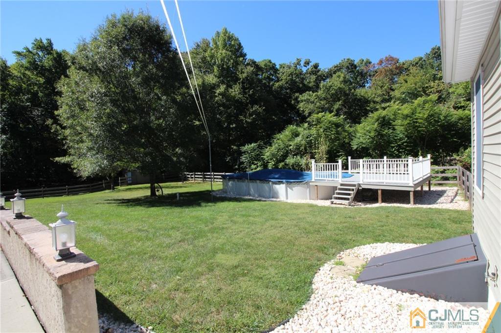 252 Deans Rhode Hall Road Monroe Township, NJ 08831 - Photo 4 of 25 a view of a garden with deck