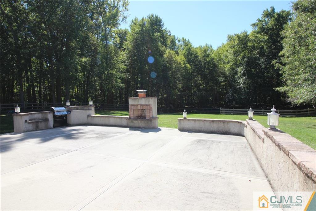 252 Deans Rhode Hall Road Monroe Township, NJ 08831 - Photo 5 of 25 a view of a swimming pool with a patio