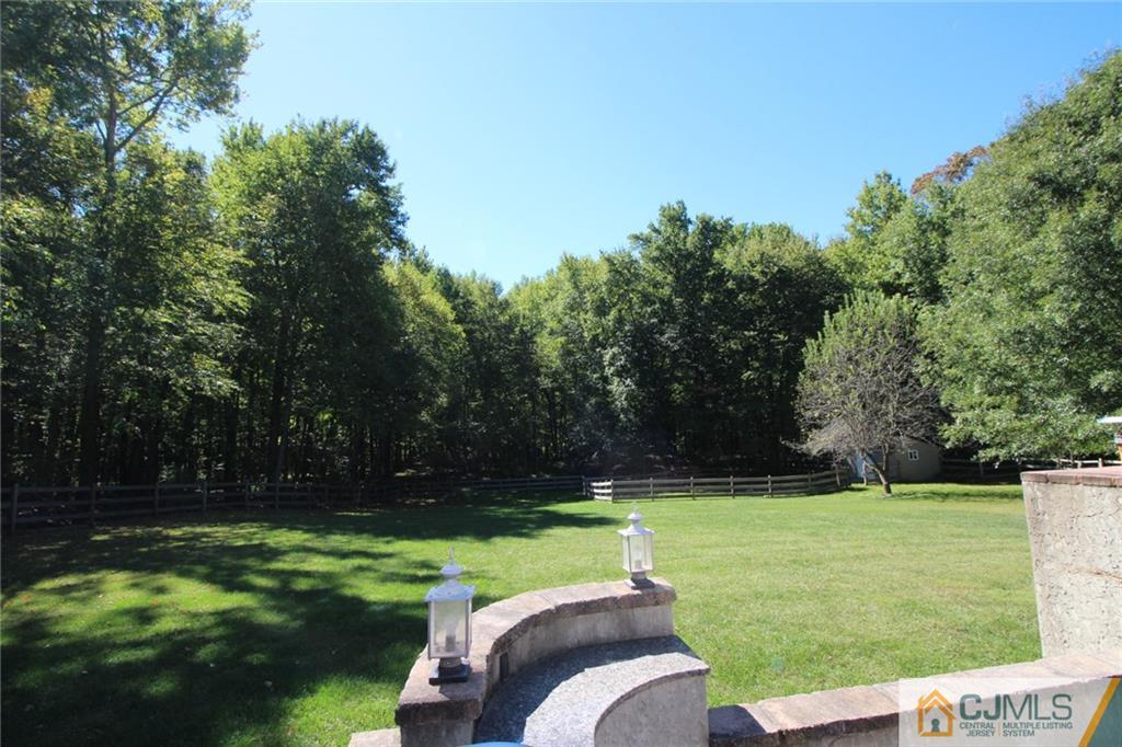 252 Deans Rhode Hall Road Monroe Township, NJ 08831 - Photo 6 of 25 a view of a golf course with a lake