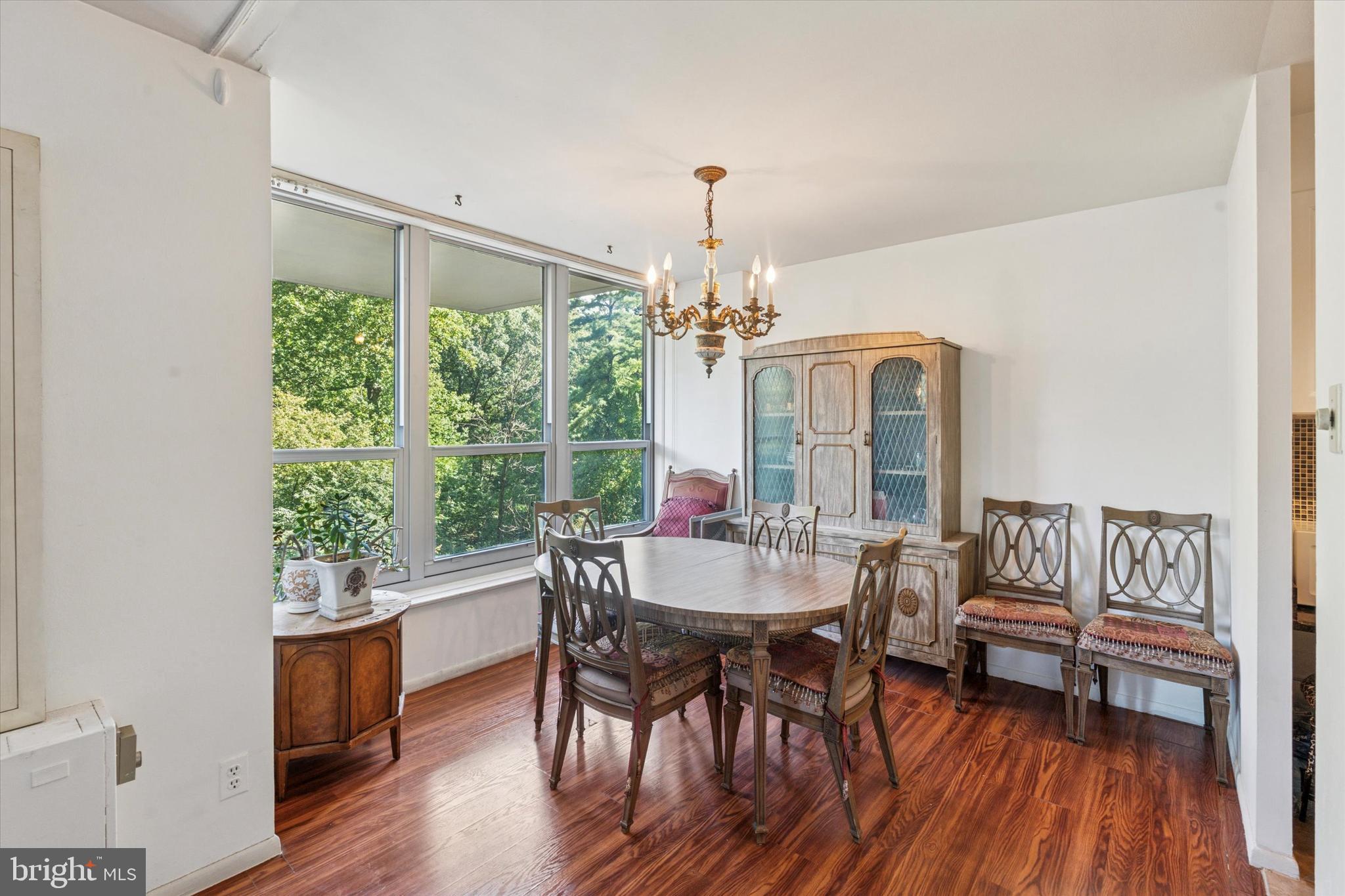 3600 Conshohocken Avenue, Unit 116 Philadelphia, PA 19131 - Photo 11 of 25 a view of a dining room with furniture window and wooden floor