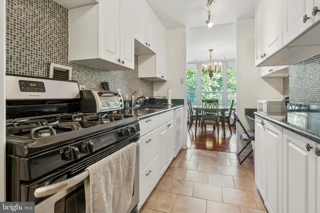 a kitchen with a stove and a sink