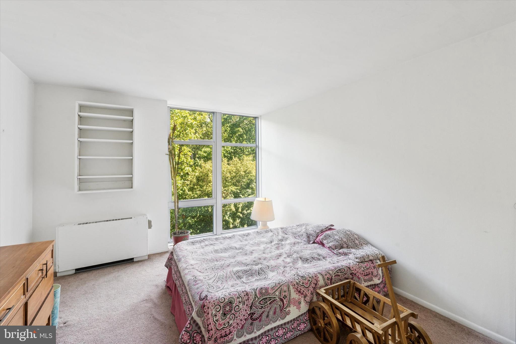 3600 Conshohocken Avenue, Unit 116 Philadelphia, PA 19131 - Photo 15 of 25 a bedroom with a bed and a window