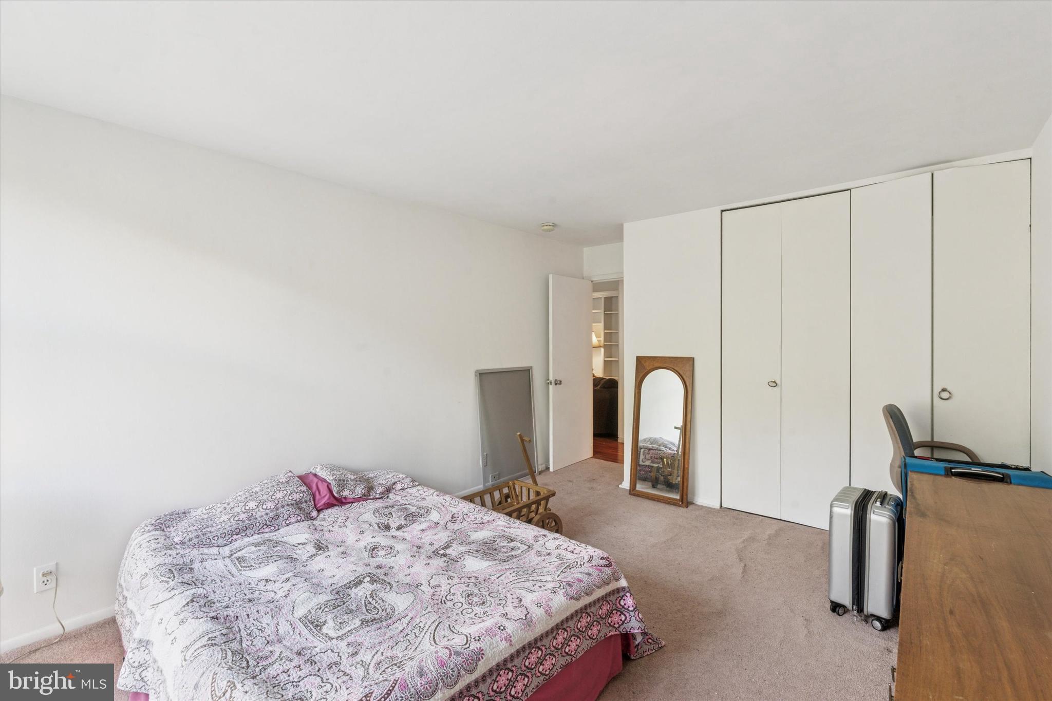 3600 Conshohocken Avenue, Unit 116 Philadelphia, PA 19131 - Photo 16 of 25 a bedroom with a bed and a dresser