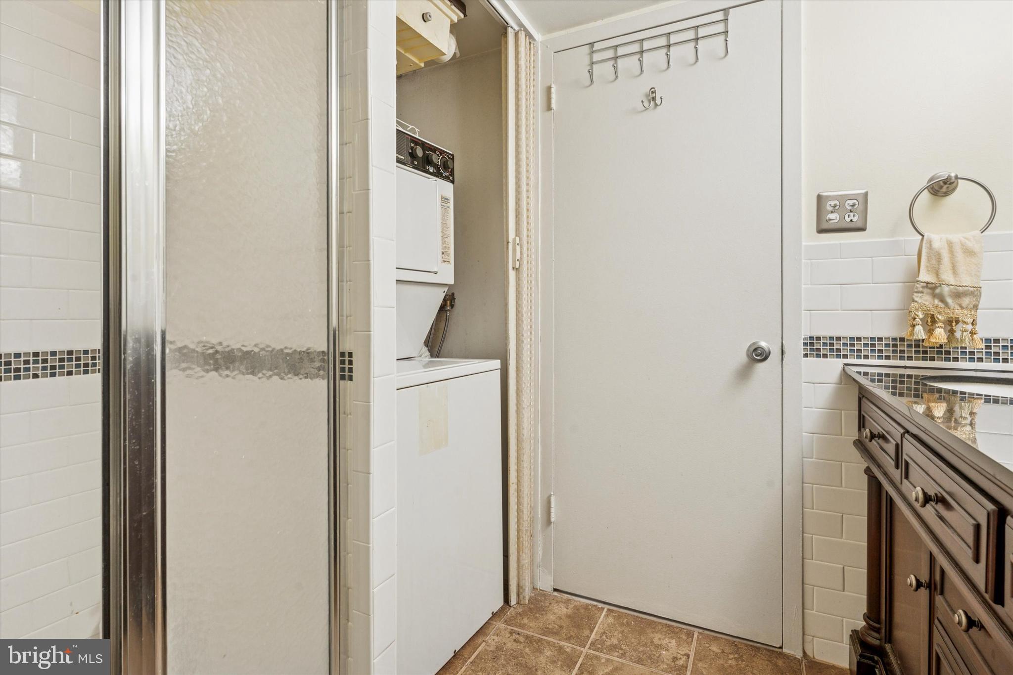 3600 Conshohocken Avenue, Unit 116 Philadelphia, PA 19131 - Photo 18 of 25 a view of bathroom with utility room and washer