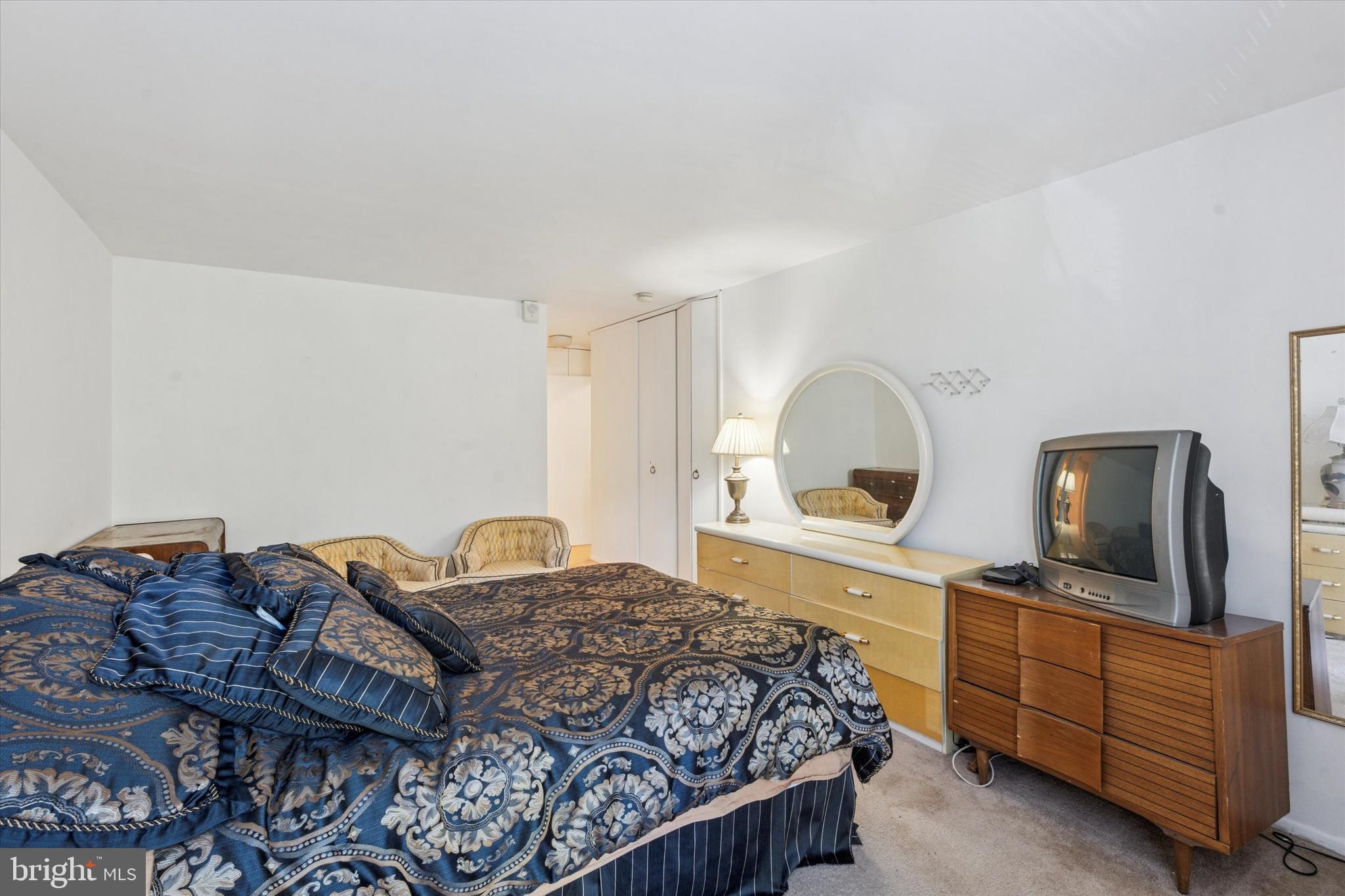 3600 Conshohocken Avenue, Unit 116 Philadelphia, PA 19131 - Photo 20 of 25 a bedroom with a bed and a flat screen tv