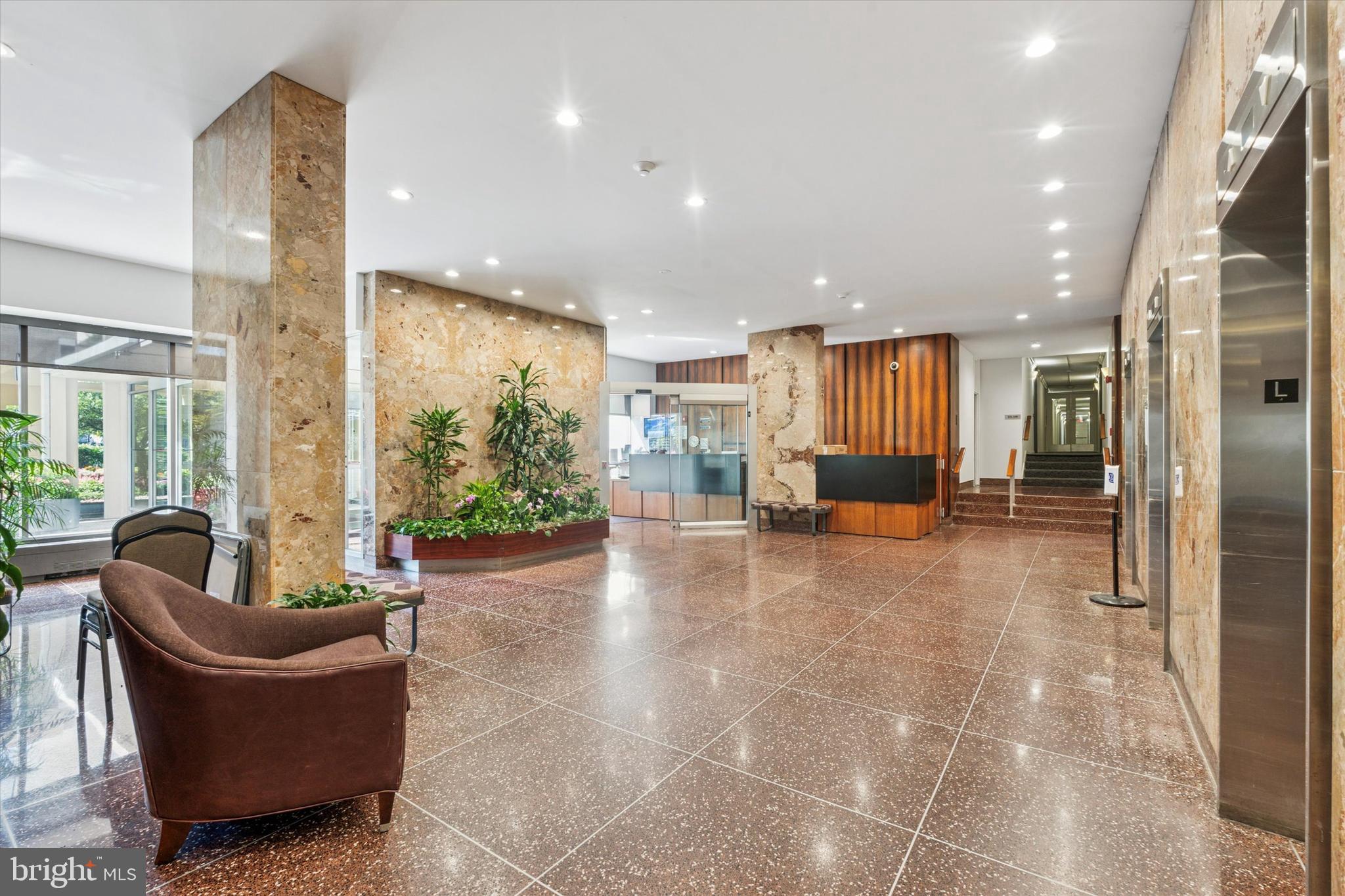 3600 Conshohocken Avenue, Unit 116 Philadelphia, PA 19131 - Photo 2 of 25 a living room with furniture and a large window