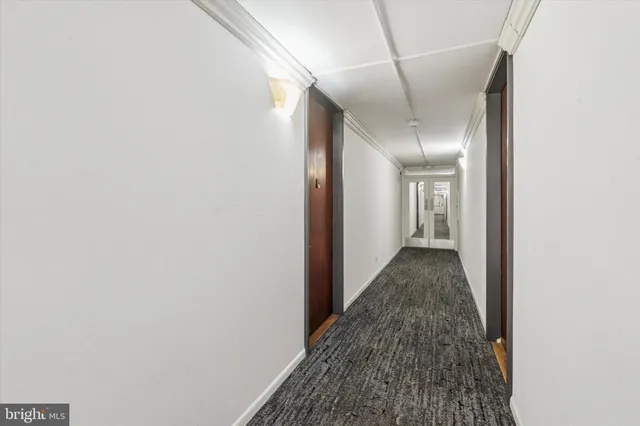 a view of a hallway with a white walls