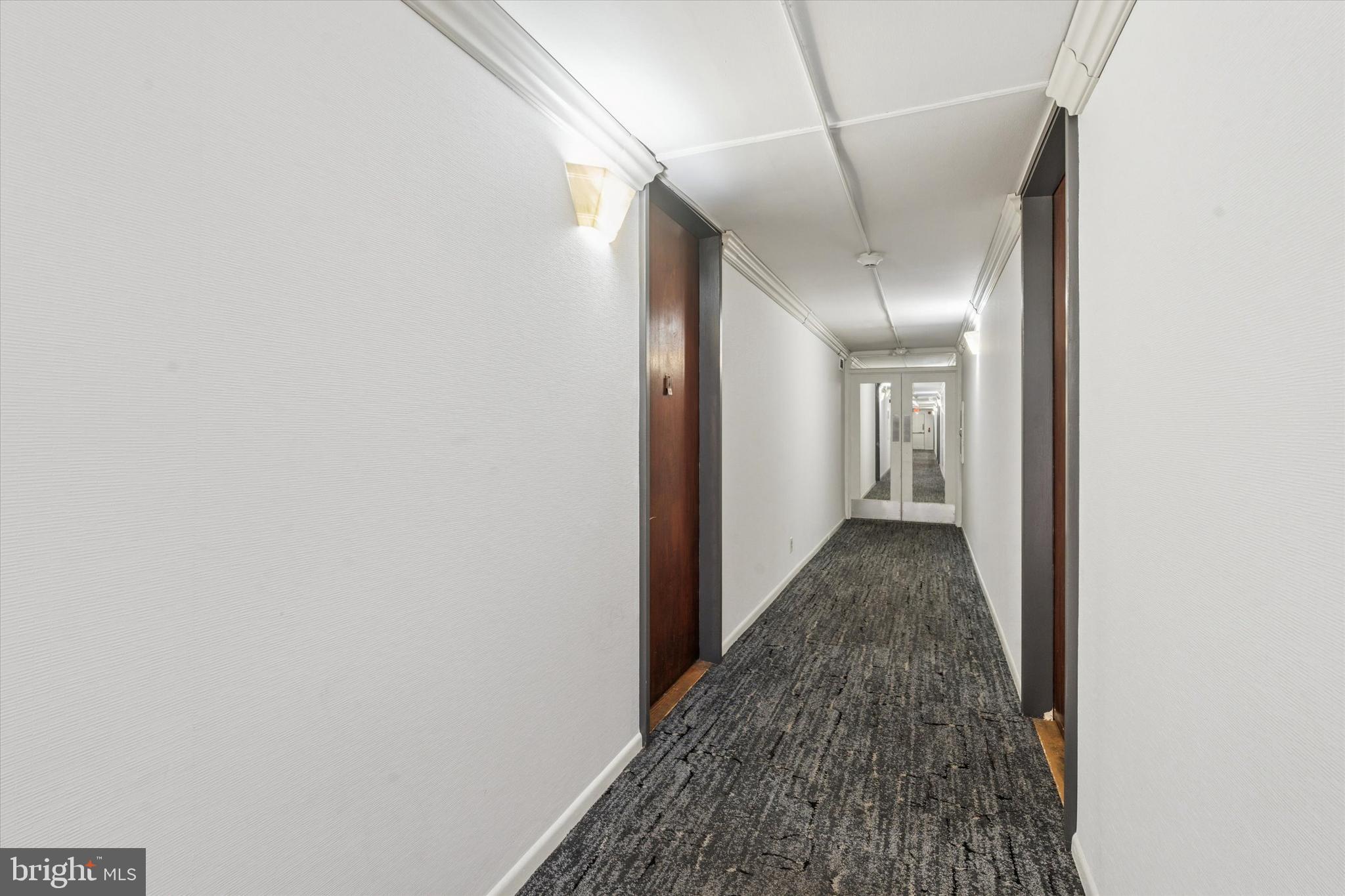 3600 Conshohocken Avenue, Unit 116 Philadelphia, PA 19131 - Photo 24 of 25 a view of a hallway with a white walls