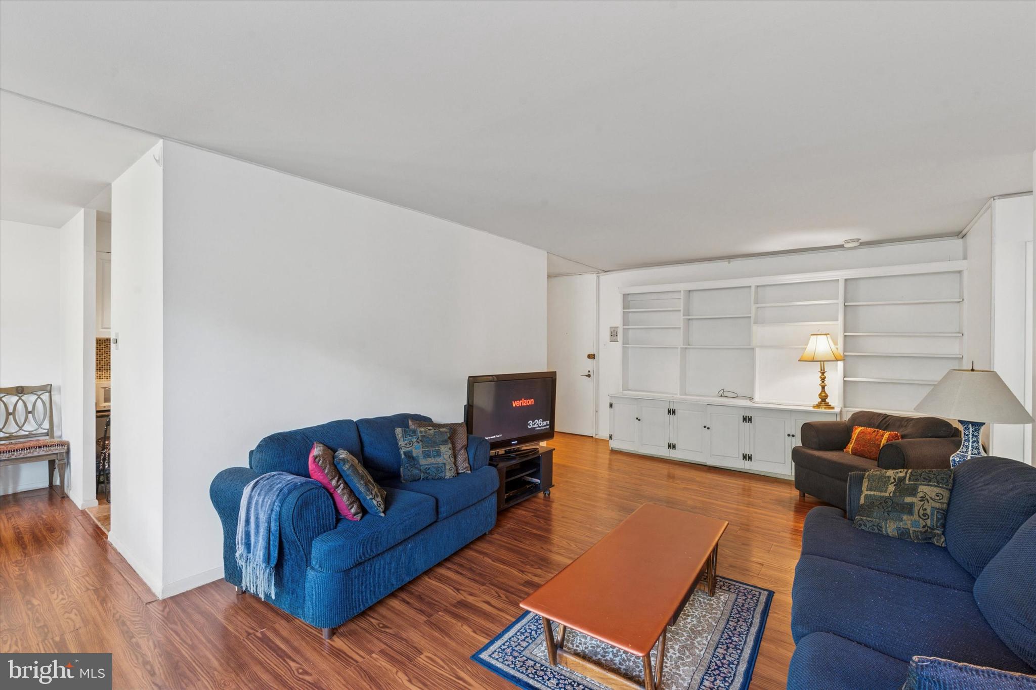 3600 Conshohocken Avenue, Unit 116 Philadelphia, PA 19131 - Photo 4 of 25 a living room with furniture and wooden floor
