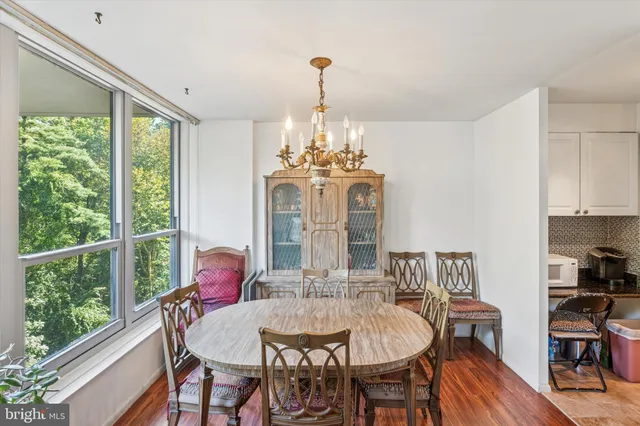 a view of a dining room with furniture window and outside view