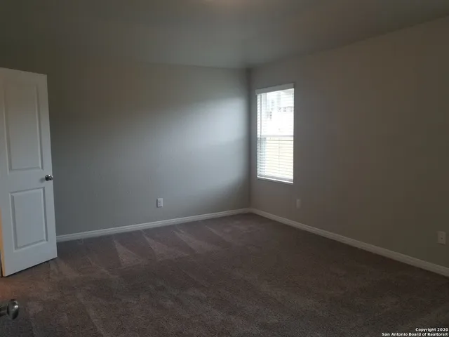 an empty room that has a window
