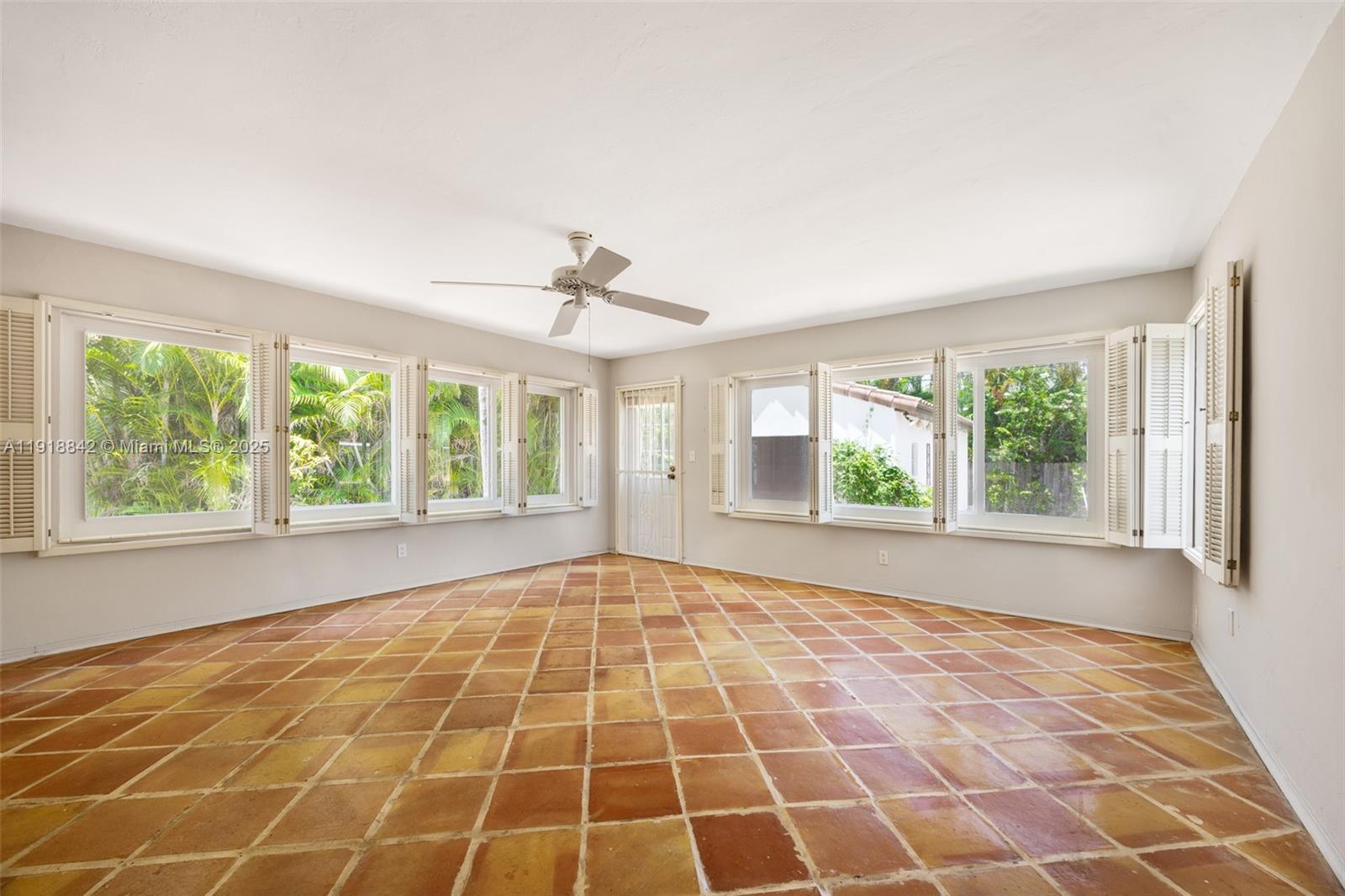 451 Southwest 25th Road, Unit 451 Miami, FL 33129 - Photo 6 of 10 a view of an empty room with windows