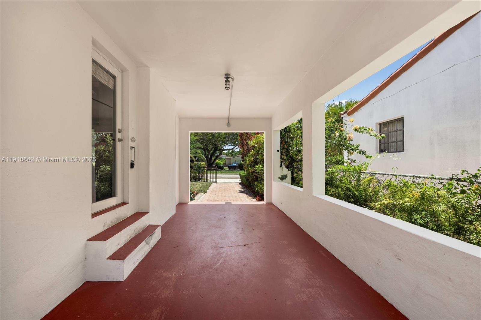 451 Southwest 25th Road, Unit 451 Miami, FL 33129 - Photo 9 of 10 a view of a door and wooden floor