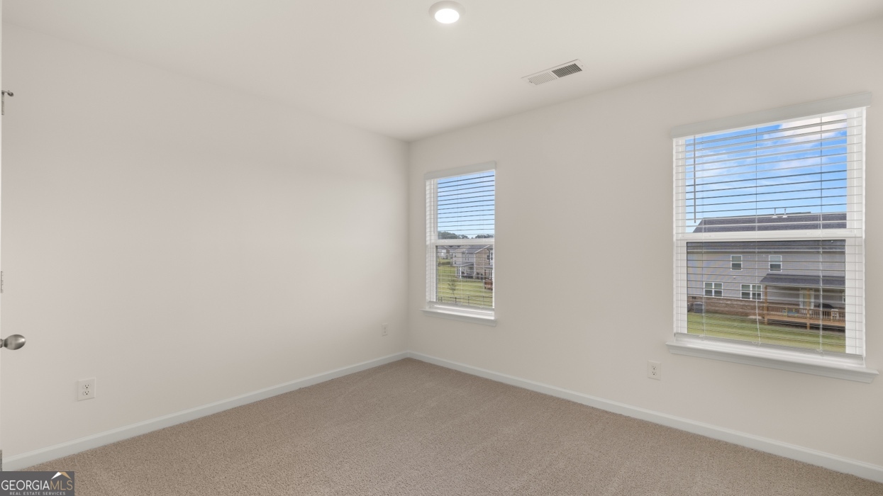 416 Hazel Drive Locust Grove, GA 30248 - Photo 21 of 31 a view of an empty room with a window