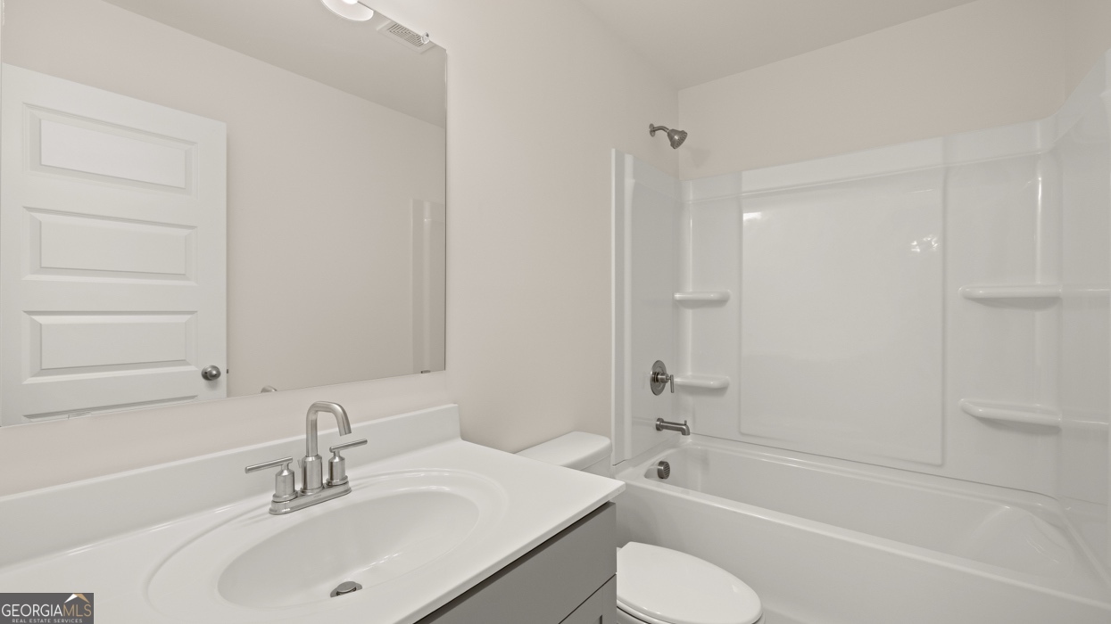 416 Hazel Drive Locust Grove, GA 30248 - Photo 23 of 31 a bathroom with a sink toilet and shower