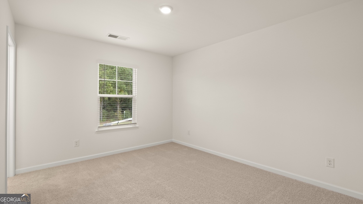 416 Hazel Drive Locust Grove, GA 30248 - Photo 24 of 31 an empty room with a window